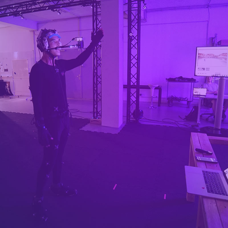 Speaker in our motion capture studio holding a live presentation in VR